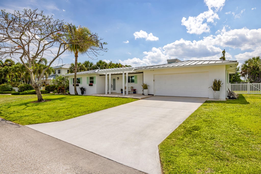 Photo of 461 Apollo Drive, Juno Beach, FL 33408 (MLS # B26068979)