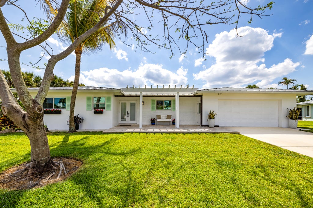 Photo of 461 Apollo Drive, Juno Beach, FL 33408 (MLS # B26068979)