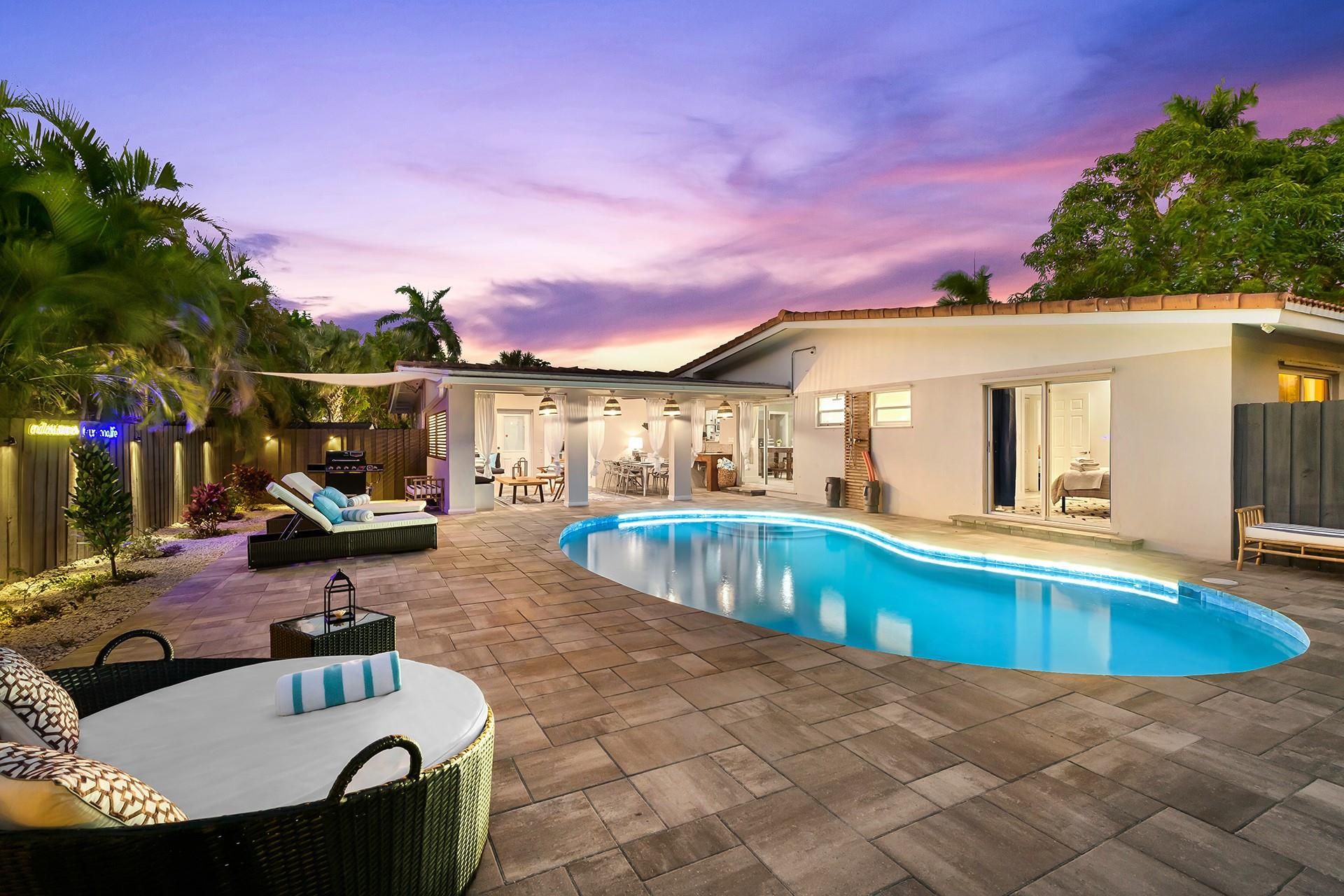 Prepare to step into your dream home! This beautiful four-bedroom, three-bath residence is ideally situated in the charming Coral Woods area, where all your favorite conveniences are just around the corner! The open floor plan flows seamlessly into your lovely solar-heated pool and inviting patio, creating the perfect setting for pleasant outdoor dining and relaxation. You'll find the primary suite features its own private wing, complete with a cozy home office and a lovely bath. Every inch of this home is designed with care for both function and comfort. You're going to love the spacious bedrooms, and the beautiful bathrooms add a touch of elegance that you can't resist! Can be sold furnished or unfurnished. *House sits on two lots for possible redevelopment*