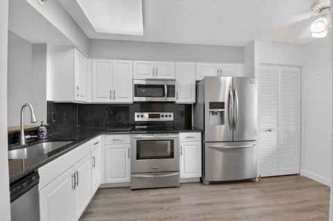 Photo of 6080 Huntwick Terrace #405, Delray Beach, FL 33484 (MLS # B26043614)