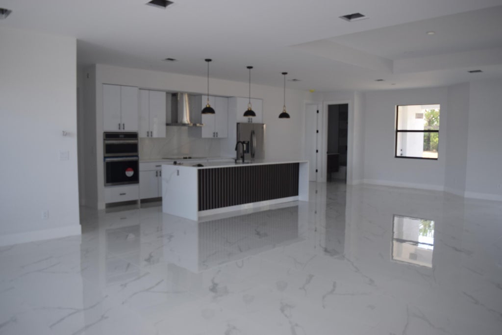 Photo of 5381 NW Dell Court, Port Saint Lucie, FL 34986 (MLS # R10990164)