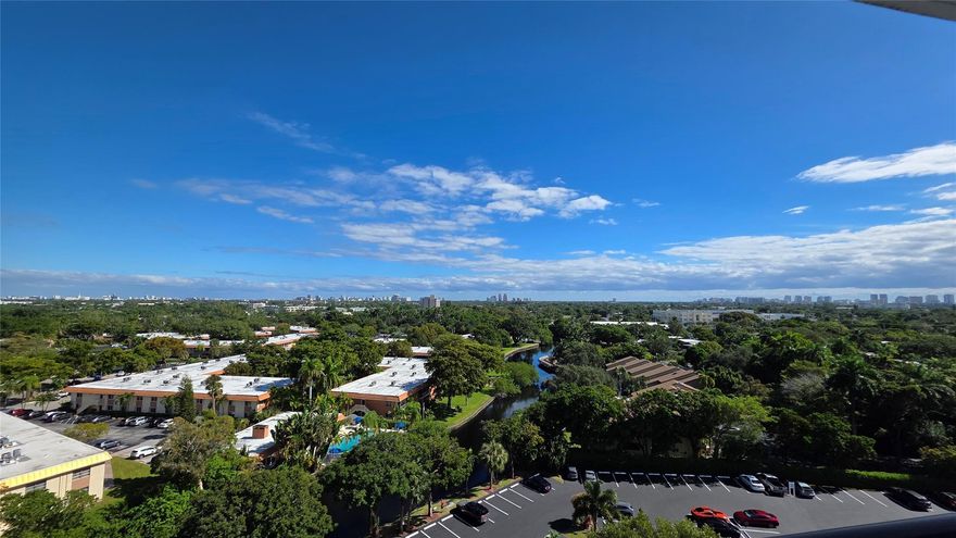 VIEWS VIEWS VIEWS!  Come see this 11th floor unit with unobstructed EAST facing views. Open balcony offering beautiful sunrises & long-range views of the Middle River. Unit has impact windows & slider door. Building features a secure lobby, plenty of owner parking behind gate, plus beautiful pool overlooking the river. The 40-year inspection is complete. $731.62 monthly assoc. fee includes cable, internet, water, sewer, trash, laundry use, & pest control. Pet-friendly (one pet, under 20 lbs allowed). Sorry, no rentals in the first year. The association requires a 650 & financing transactions require 20% down. The property has on-site management and good reserves. Assigned storage also included. All information believed accurate, but not guaranteed.