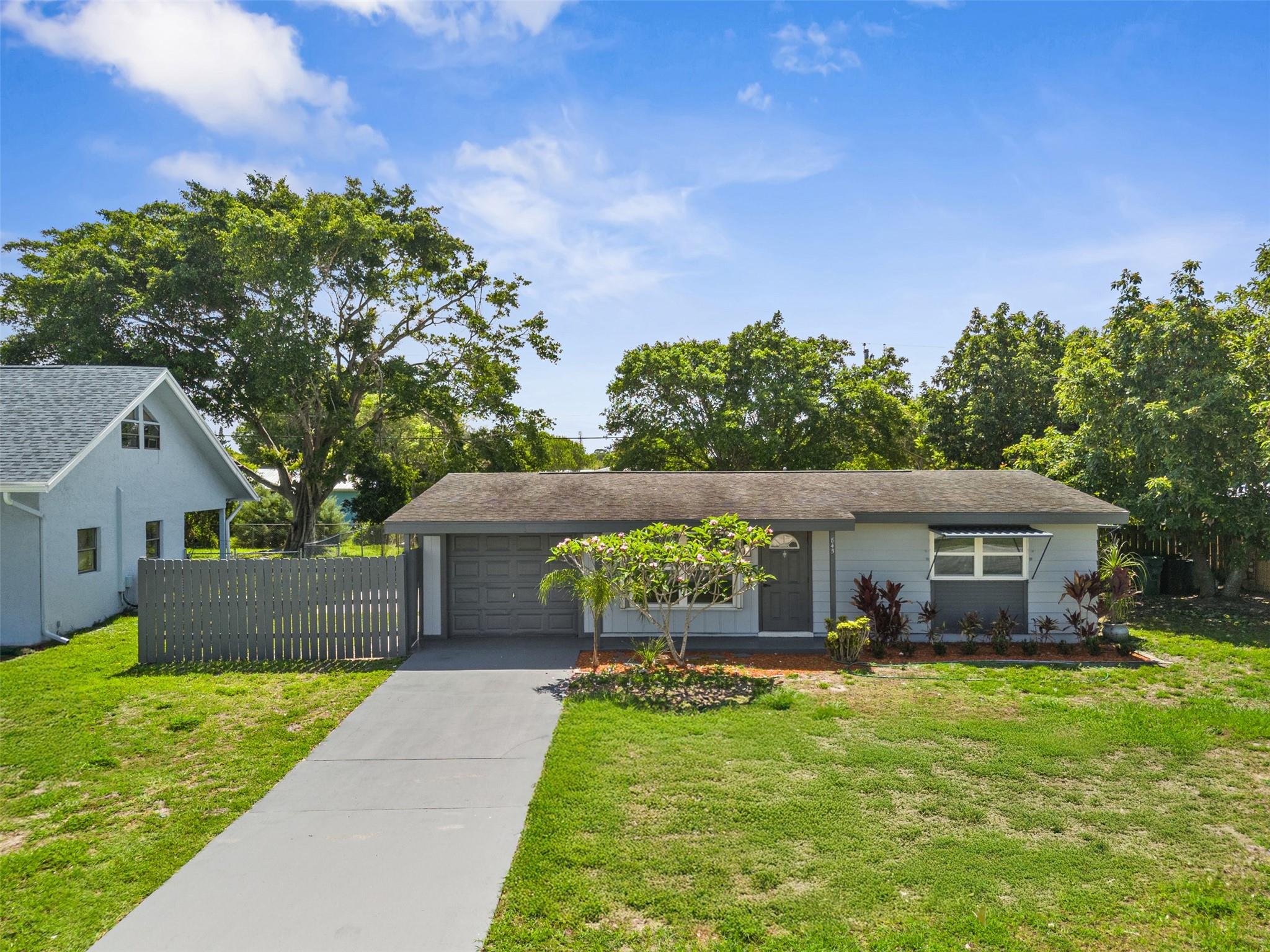 Charming single-family home in the heart of Port St. Lucie! This 2-bedroom, 2-bathroom home features a spacious den that can be used as an office, playroom, or guest room. Enjoy a brand new kitchen, new flooring, updated bathrooms, fresh paint, and modern appliances, all recently remodeled! The large yard is perfect for pets, gardening, or future outdoor projects. No HOA, no restrictions, and no pool to maintain. Conveniently located near schools, shopping, and main highways. Ideal for first-time buyers, downsizers, or investors. Move-in ready and full of potential, schedule your showing today!
