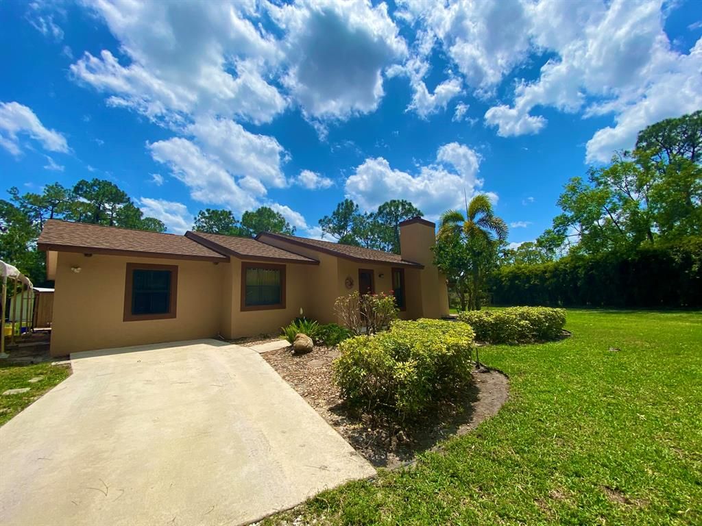 Photo of 16086 E Wiltshire Drive, Loxahatchee, FL 33470 (MLS # R10710338)