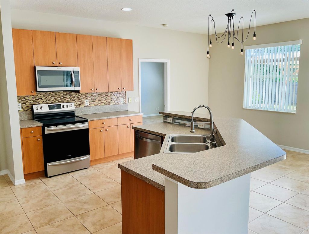 Photo of 165 NW Carmelite Street, Port Saint Lucie, FL 34983 (MLS # R10984946)