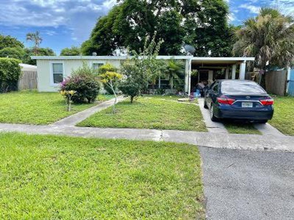 Photo of 3906 Nowata Road Rd, Lake Worth Beach, FL 33462 (MLS # R10745999)