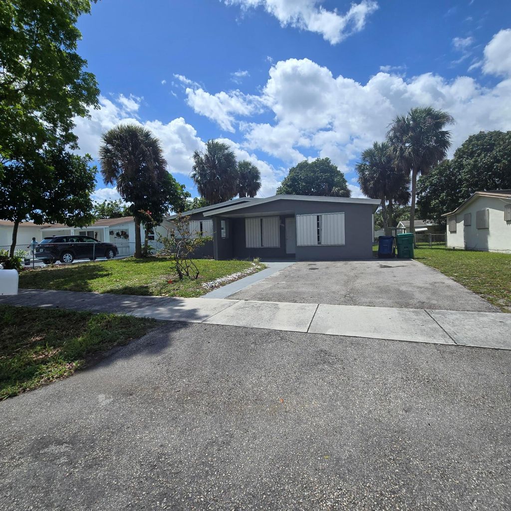 Photo of 3860 NW 8th Place, Fort Lauderdale, FL 33311 (MLS # B26018842)