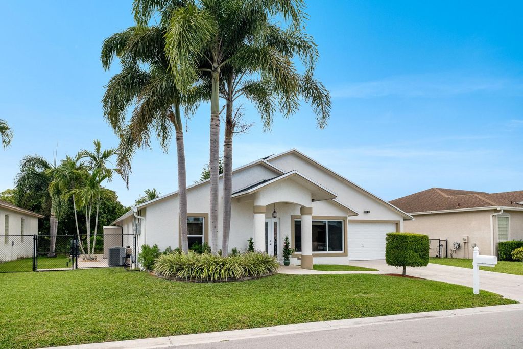 Photo of 1128 Hatteras Circle, Greenacres, FL 33413 (MLS # B26026005)