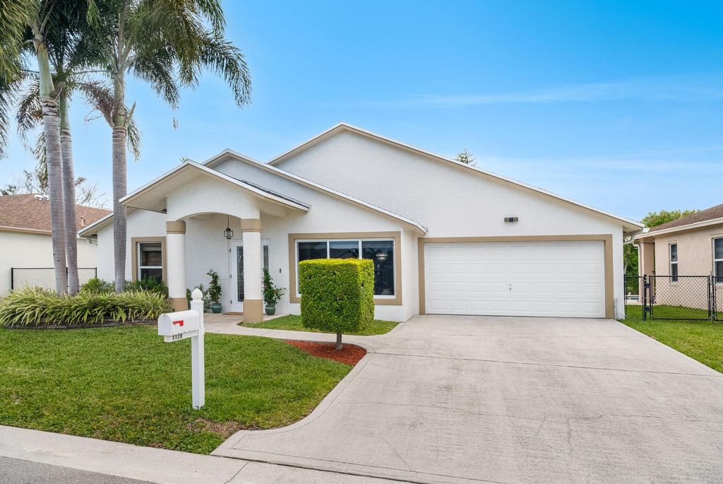 Photo of 1128 Hatteras Circle, Greenacres, FL 33413 (MLS # B26026005)