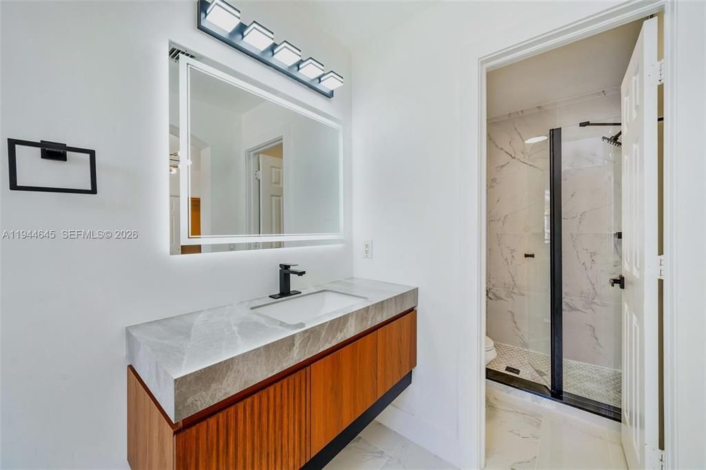 Photo of 1551 Seagrape Way, Hollywood, FL 33019 (MLS # B26016493)