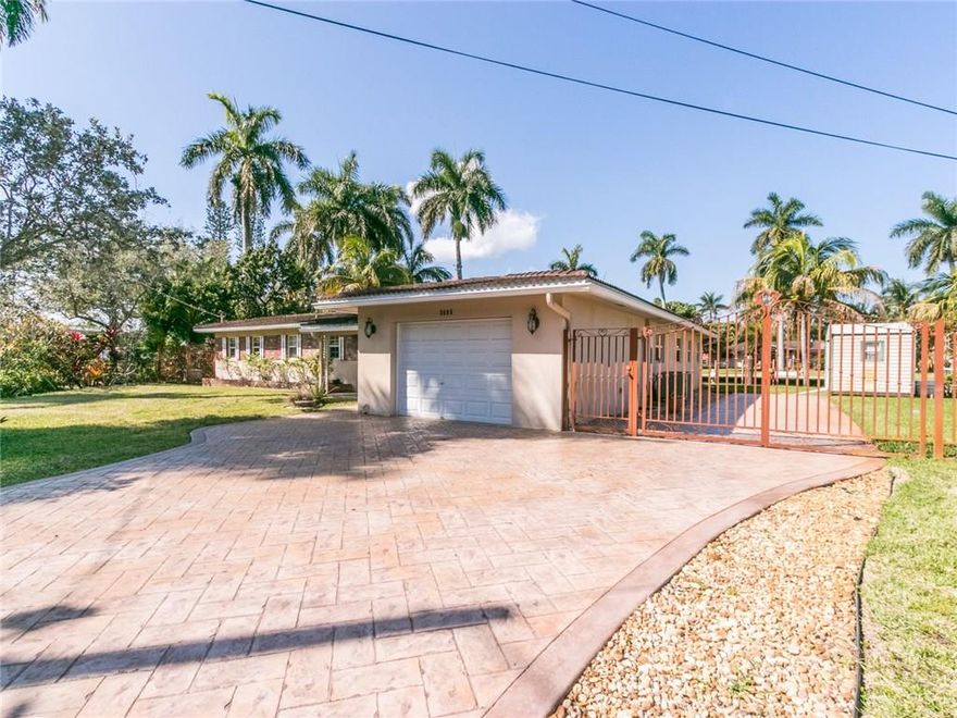 Boater's Tropical Paradise! 135' Waterfrontage 3/2 home w/pool. Remodeled Kitchen with S/S appliances. Large bright ceramic flooring in the living area. Bamboo in two rms, third has tile.Florida room features a fireplace, french doors, impact windows throughout, garage, driveway and  boat parking area. Dock w/shore power also available for an additional cost (No fixed bridges). Rent your own private enclave!...Enjoy florida living from  your backyard with canal and pool view!