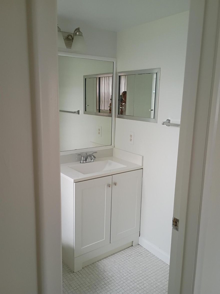 Airy and bright corner unit. Move in ready.