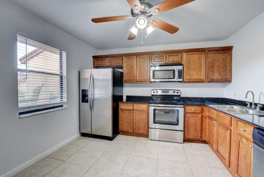 Photo of 2006 Lakeview Drive W, Royal Palm Beach, FL 33411 (MLS # R11150948)