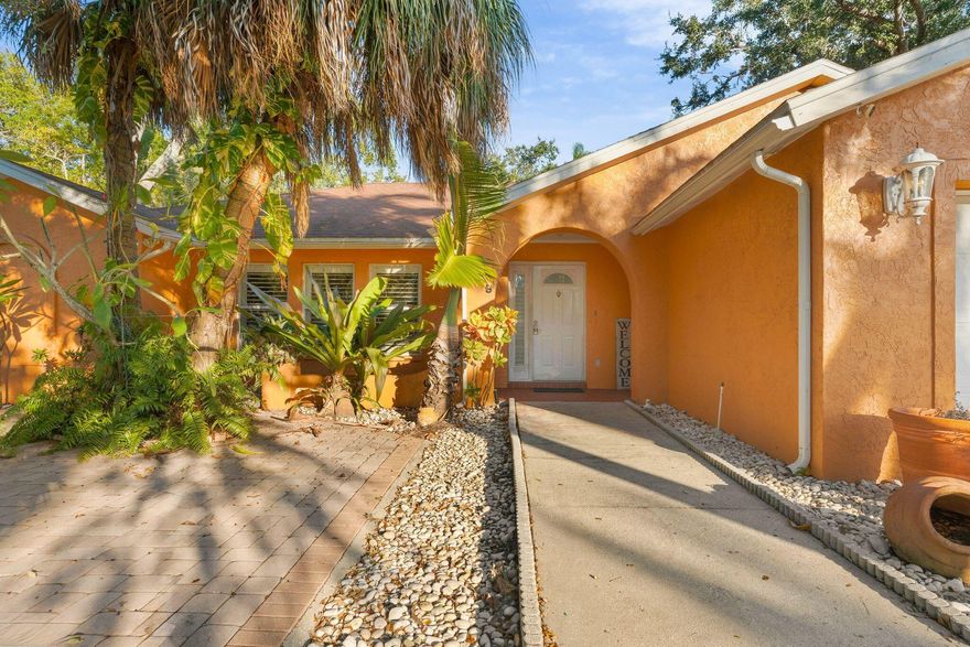 Is this a full acre home less than one minute from the public boat ramp? YES IT IS! Boasting only one owner from the moment it was custom built, the floor plan thoughtfully designed w/multiple expansive living areas. An incredible & rare opportunity to expand, enhance, or simply enjoy the exclusivity of owning a full acre less than ten minutes from downtown, a short drive to the world renowned beaches of Anna Maria Island and Long Boat Key. The location is unbeatable even for a commuter 7 minute drive to interstate and highways. The enclave spans a sun room, a cabana bath, a working fireplace, wall to wall closets, a welcoming breakfast nook met with bay windows & plantation shutters. Corian countertops, gas water heater! A detached workshop w/plumbing & electricity. CBS. One of its kind,