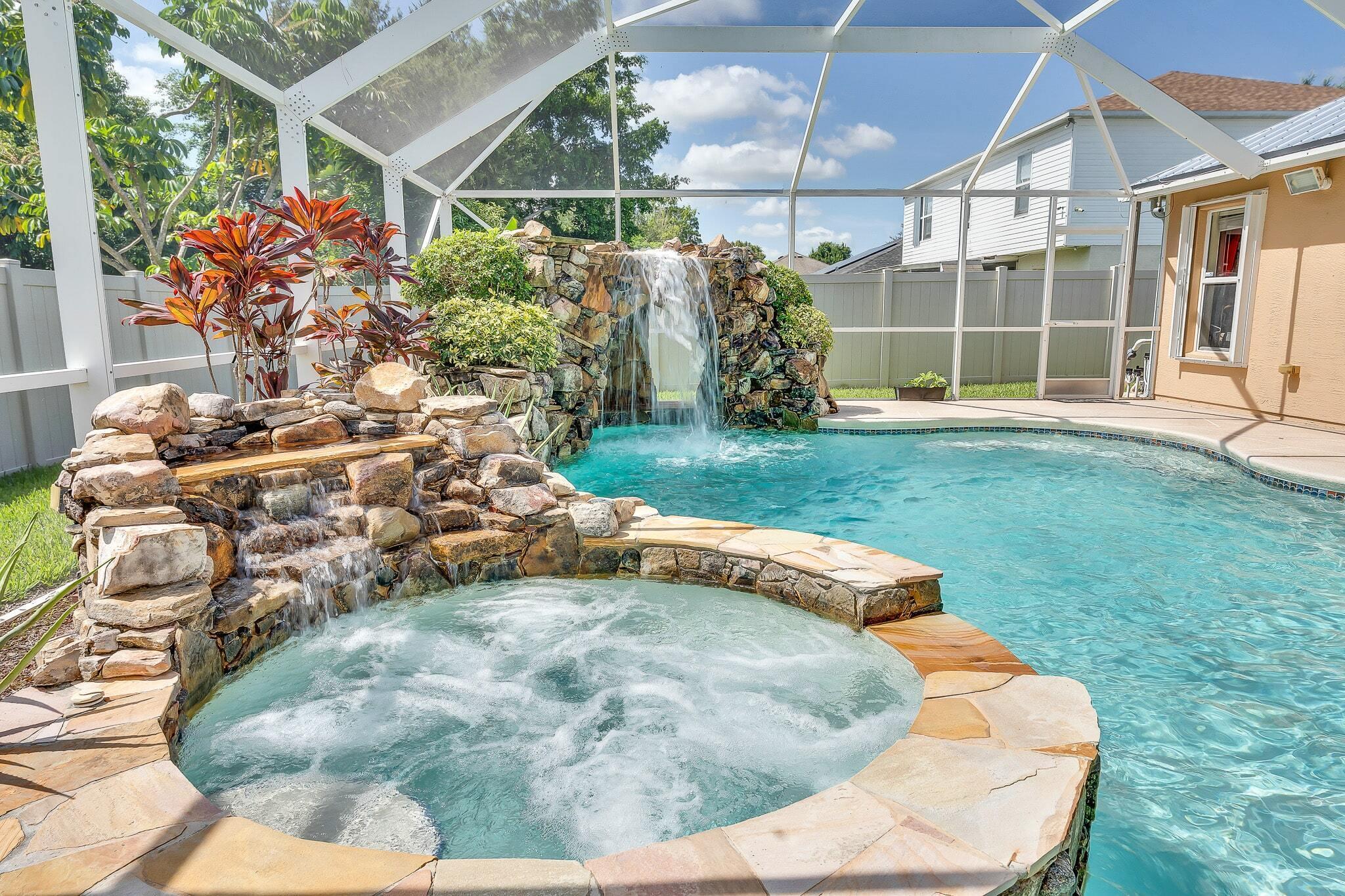 Welcome to Your Private Oasis! This Beautifully Maintained 4 Bedroom, 2 Bathroom Pool Home Features a Stunning Resort Style Pool Complete with a Grotto Waterfall and Spa!- Perfect for Relaxing or Entertaining. FEATURES a BRAND NEW METAL ROOF - 2025! This Home is Centrally Located Near Tradition, Shopping, Dining, and the Highways with NO HOA! With a Spacious Split Floor Plan, This home Offers Plenty of Room for Everyone! Large Fenced in Backyard! New Blinds Throughout Home, Just Installed. Screen Enclosure Door for Garage for Extra Space.