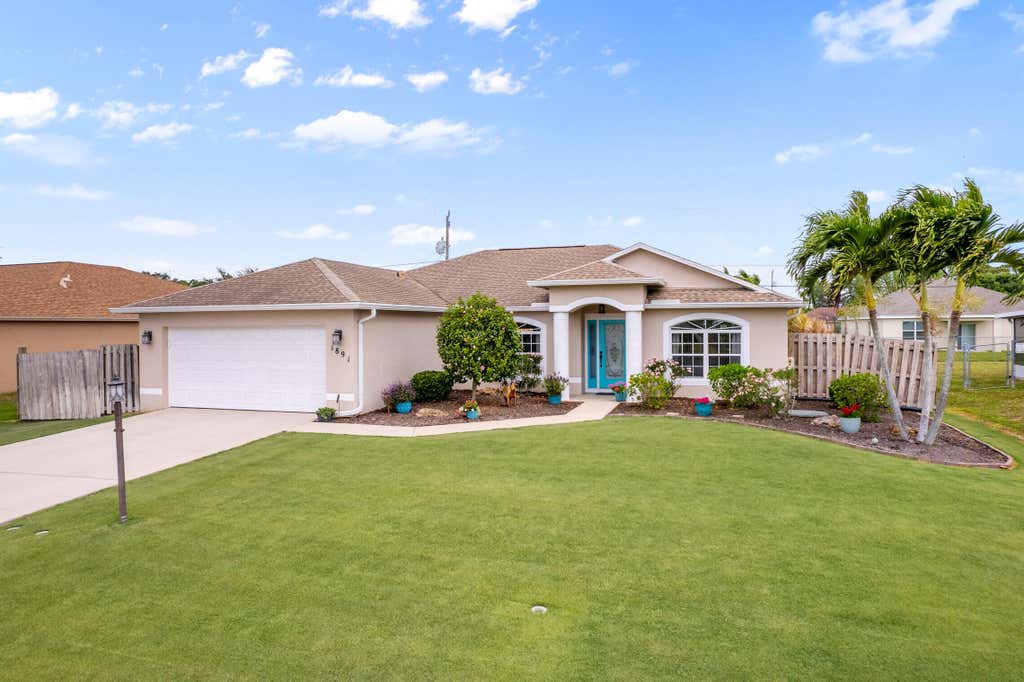 Photo of 1891 SW Dalmatian Avenue, Port Saint Lucie, FL 34953 (MLS # R10793439)