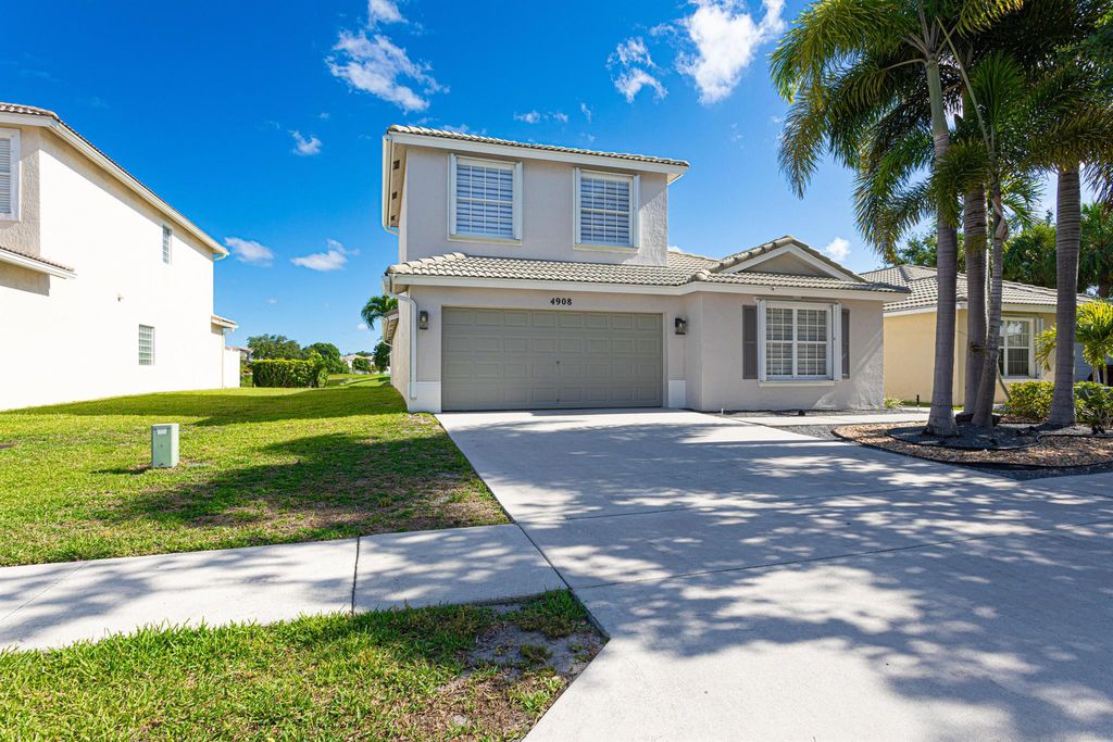 Photo of 4908 Lombard Pass Drive, Lake Worth, FL 33463 (MLS # R10991282)