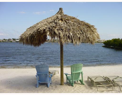 Gorgeous Totally Remodeled 3 Bdrm, 2 Ba, 1 Car Garage LOCATED in an Intracoastal Private Gated Community with beautiful Sandy Beaches. Condo includes beautiful Cabinets, Countertops, new SS/Appliances, New Flooring & LED Lighting thru-out, New A/C, W/H. New paint thru-out. All New Hurricane Windows. A short walk to Clubhouse where you can enjoy all the RESORT STYLE AMENITIES. - Pool, Spa, Billiards. Community offers Kayak Racks for small fee. LOCATION, LOCATION, LOCATION.! GREAT FOR BOATERS! SITS NEXT TO (Boat Marina) which is open to the Public w/Boat Rental Storage for your boat.