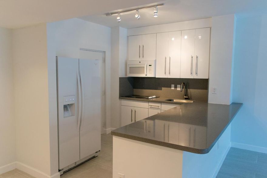 MUST SEE!! Beautiful apartment which has been completely renovated with new kitchen cabinets, new appliances, quartz countertop, stainless steel sink, it has an OPEN KITCHEN, all porcelain tile, custom made closets, updated bathrooms with granite vanities and a very nice balcony. YOU WILL LOVE IT.
