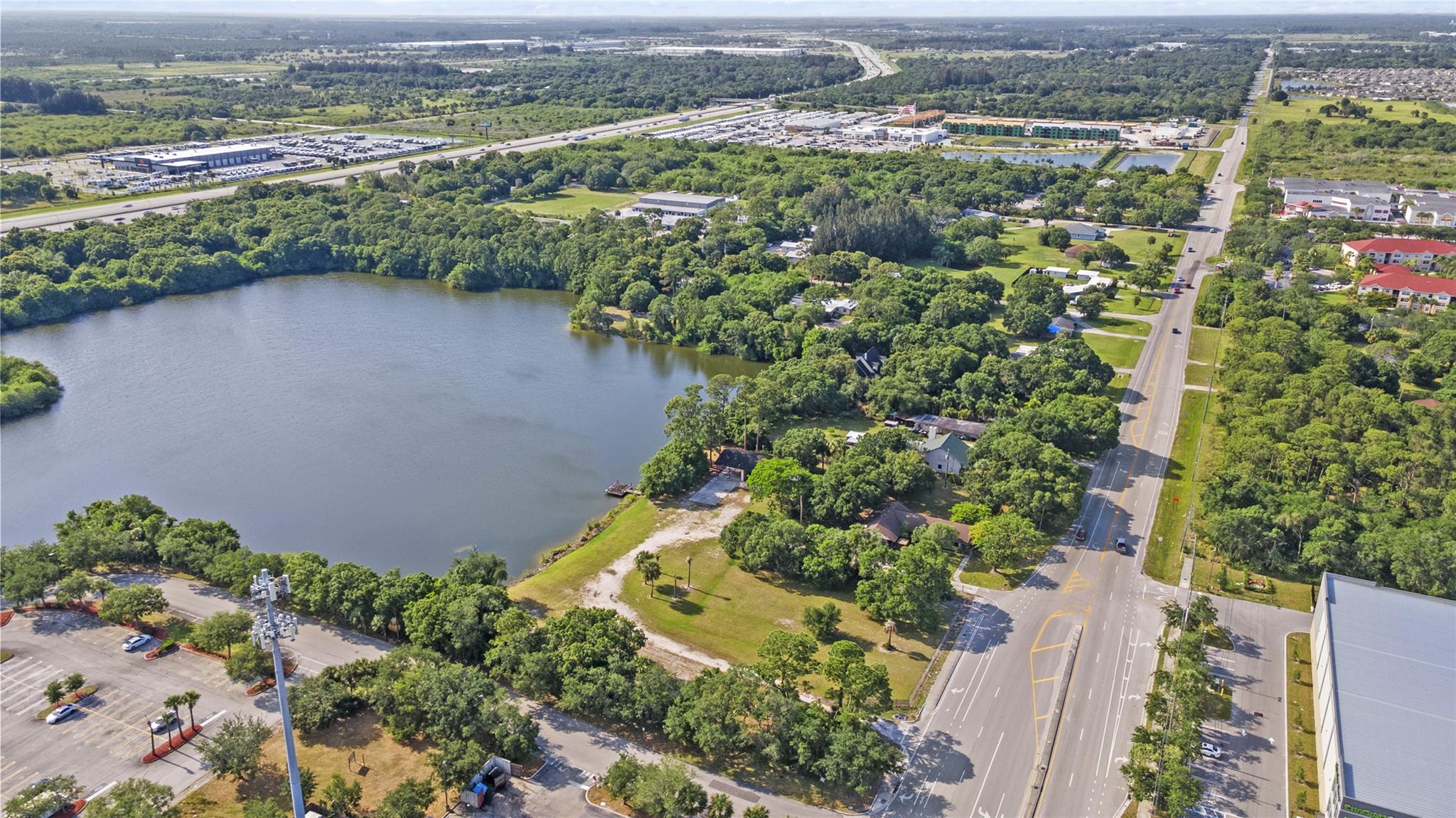 Secure this versatile 3-acre lot featuring lake access, 3 storage bays, and a single-family home perfect for trailer storage, logistics operations, or live/work setup. Just minutes from major corridors and next to Home Depot and Sonic.
Property Highlights:
3 Bays for storage or enclosed operations
2 Electrical Meters for flexible tenant use
Two Entrances for efficient truck circulation and access control
Zoned CG (Commercial General) – allows heavy-duty parking
Flat, cleared lot with ample room for semi-trucks, containers, and equipment
Lake frontage offers drainage benefits and unique aesthetic value
On-site 3BD/1BA home with screened-in back porch—ideal for on-site staff or owner-use