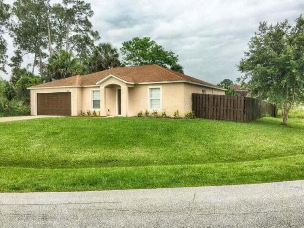 Photo of 2625 SW Acco Road, Port Saint Lucie, FL 34953 (MLS # R11060463)