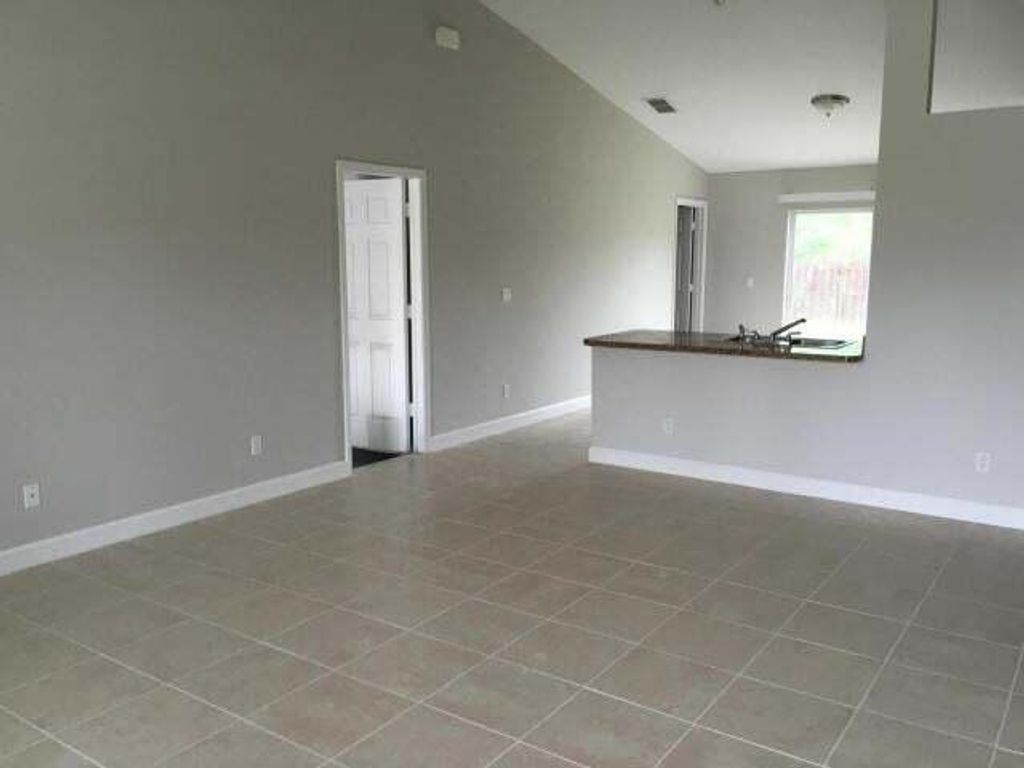 Photo of 2625 SW Acco Road, Port Saint Lucie, FL 34953 (MLS # R11060463)