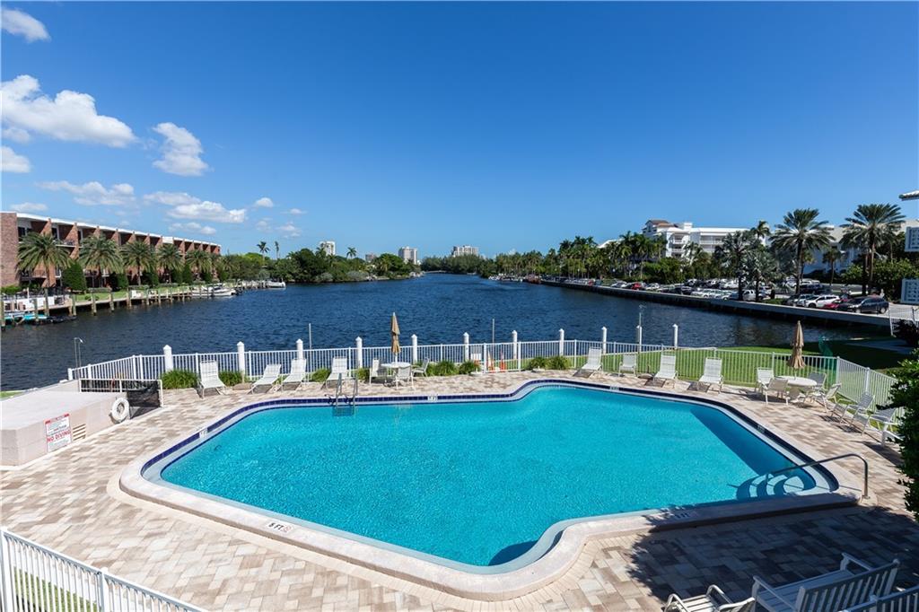 Totally renovated unit overlooking the beautiful Lake Mayan and directly across the street from Fort Lauderdale's widest, palm-filled beach. Perfect for the seasonal snowbird or the year-round resident looking to scale down at this quaint, boutique building-by-the-sea. The stunning new bright and open kitchen features quality appliances, contemporary glass tile backsplash, elegant under cabinet lighting, quartz countertops that include an elevated bar area with gorgeous stone tiling. New, wood-like grey flooring throughout unit for a consistent, casual beach-vibe feel. The bath has a luxurious feel w/ quartz countertop and a frameless glass step-in shower. Boat dockage when available. Co-Op. CASH ONLY, NO PETS, NO RENTING 1ST YEAR.