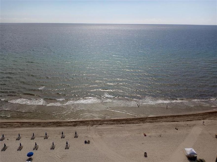 SPECTACULAR DIRECT OCEAN VIEW FROM THIS LARGE SOUTHEAST CORNER UNIT! 2 BEDROOMS PLUS DEN! TILE FLOORS THROUGH-OUT! NEW HURRICANE PROOF WINDOWS AND BALCONY DOORS!! NEW GLASS BALCONY!!GARAGE SPOT INCLUDED! NEWLY RENOVATED OCEANFRONT BUILDING! FULL AMENITIES INCLUDING: BEACH SERVICE, 2 POOLS, GYMS, SAUNA, BILLIARDS, RESTAURANT, 24-HR SECURITY AND VALET PARKING FOR GUESTS. IMMEDIATE RENTALS ARE ALLOWED
