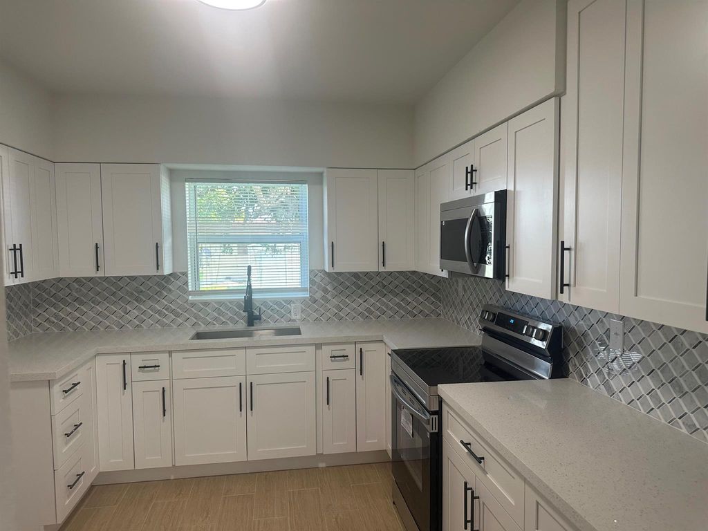 Photo of 148 S Flame Avenue, Pahokee, FL 33476 (MLS # R11129441)