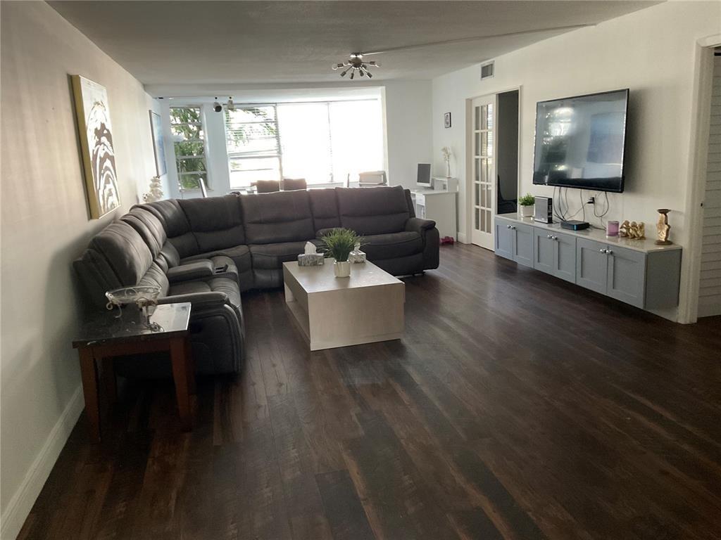 Welcome to Paradise! Beautiful lake view from all around this amazing corner unit. Bonus room. Granite countertops kitchen. Nook for Breakfast watching the lake. Beautiful updated wood floors. Central A/C. Community is located right off Miami Gardens Drive near every store you can think of! Serene and Peaceful common areas with a pond and sitting area right outside. The entire community is under renovations: new roofs, new elevators, new paint, new mailboxes, new Spa & Gym, new Play room and a new convenience store is under work in the round tower. Seller motivated. Come take a look at this Breathtaking water view condo, Today!