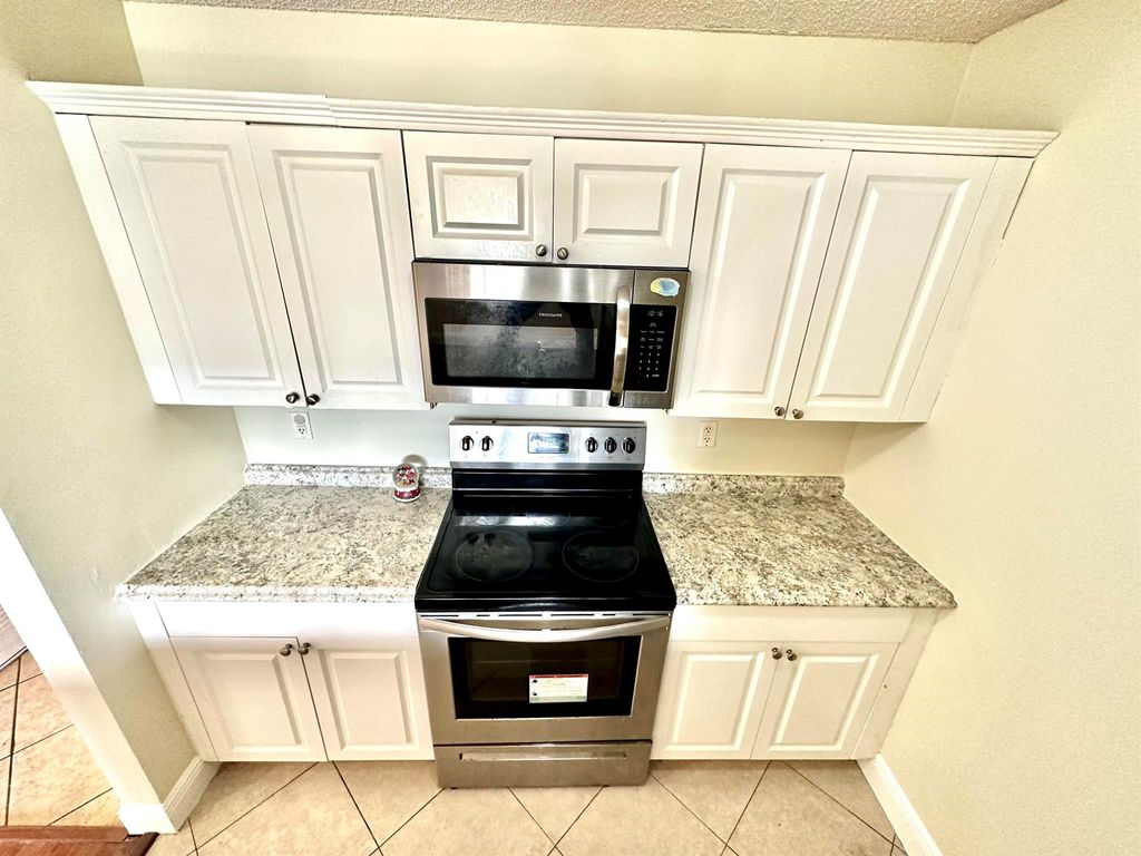 Photo of 1405 Meadows Circle, Boynton Beach, FL 33436 (MLS # R11059243)