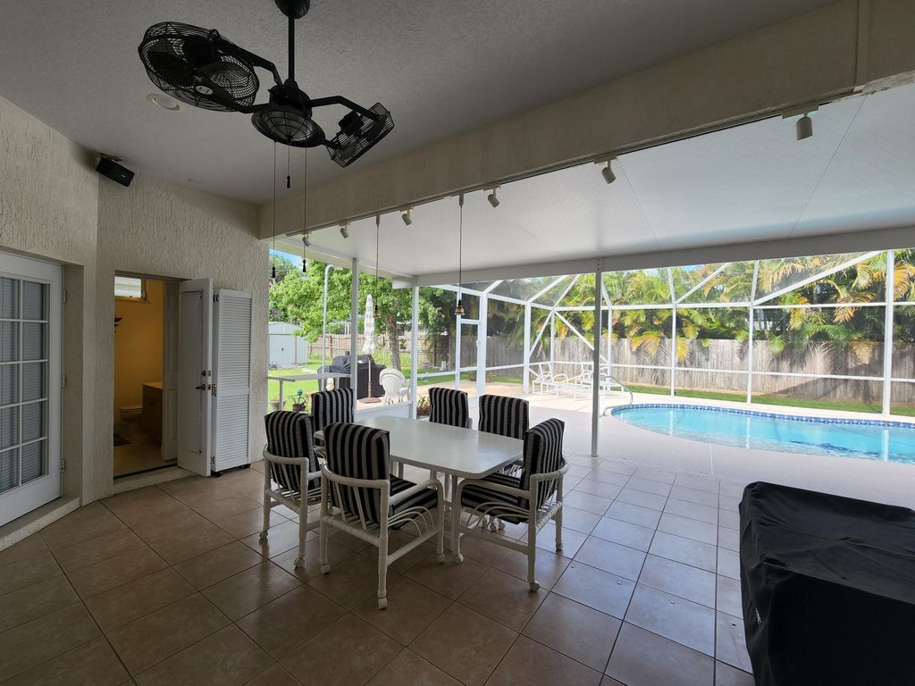 Photo of 1957 SE Dupont Street St, Port Saint Lucie, FL 34952 (MLS # R10812632)