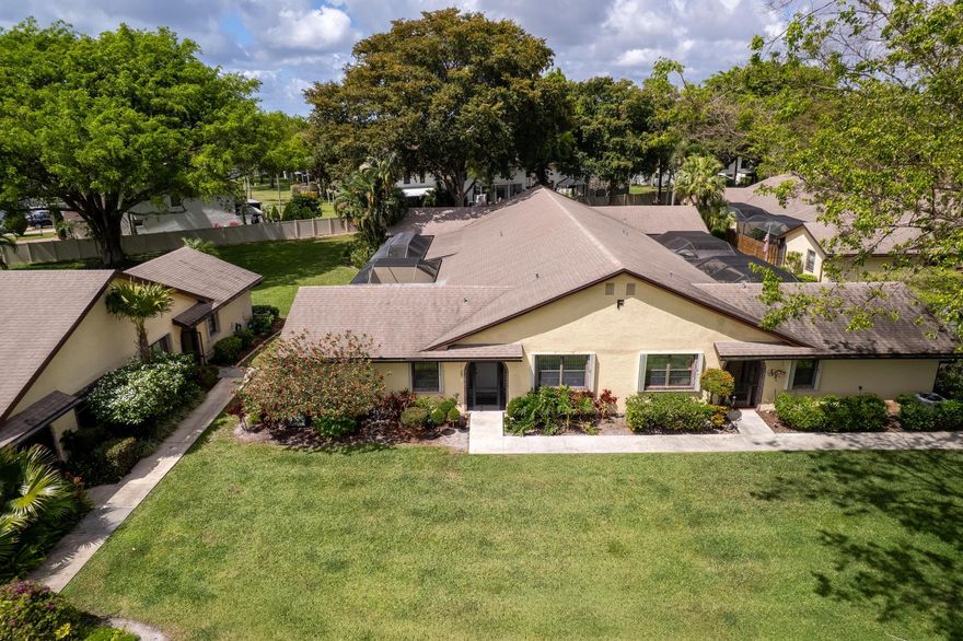 Immaculate 2bd/2ba corner villa, the largest model in Lakes of Boca Barwood, a 55+ community. The property has a split floor plan, vaulted smooth ceilings, select ceramic tile flooring throughout. Completely redesigned kitchen w/ oversized island, double sink & waterfall quartzite breakfast area. Both bathrooms have new toilets, vanities & redesigned stall showers. Oversized primary suite w/ huge walk-in closet. Separate laundry room & large storage/pantry. New electrical panel & circuit breakers. Tankless water heater. New Roof. Fully screened patio w/ ceramic tile floor throughout & permanent roof over half. Accordion Hurricane Shutters throughout. Deeded covered parking with storage. Low monthly fee includes landscaping, basic cable & amenities. Pet-friendly. SELLER FINANCING available!