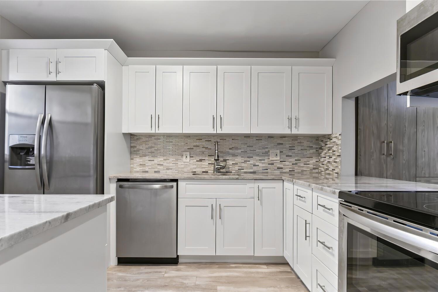 Beautiful & large updated villa with tons of storage! No expense was spared when renovating this gorgeous property! Offered as a short term rental or annual rental. Brand new IN UNIT washer & dyer combo with all the modern technology! The Brand new GE Profile ALL IN ONE washer & Dryer combo is a perfect time saver when doing laundry! No more transferring clothes from one machine to another. A fabulous location minutes from shopping, dining, and entertainment. Golden lakes Community offers so much including social events and gatherings at the clubhouse, pool, shuttle service and manned gate, just to name a few.This is a 55+ community. The primary occupant must be 55 years of age, secondary occupant can not be younger than 15 years of ag