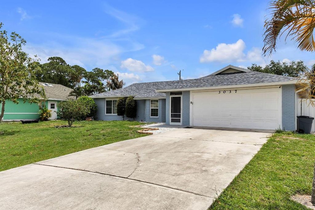 Photo of 3037 SW Circle Street, Port Saint Lucie, FL 34953 (MLS # R10996989)
