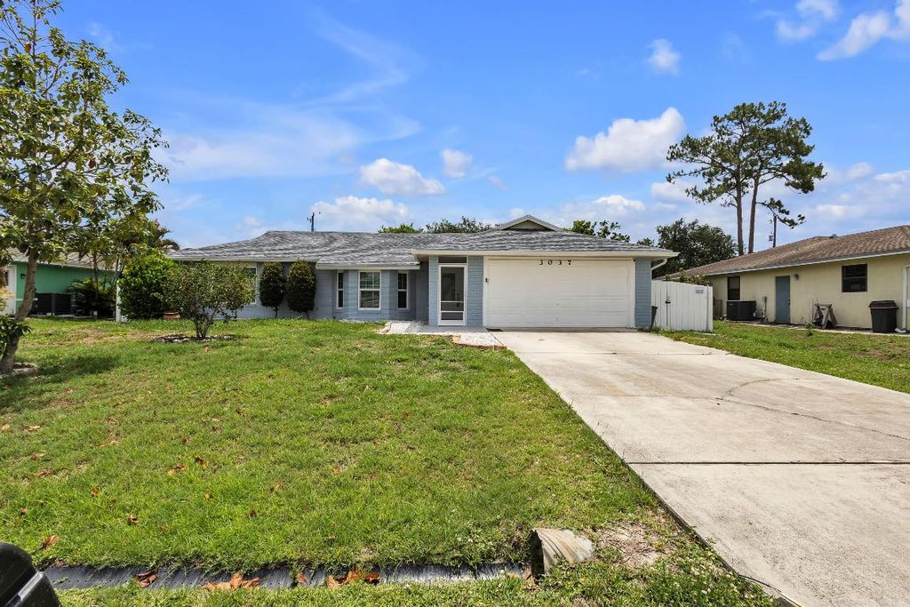 Photo of 3037 SW Circle Street, Port Saint Lucie, FL 34953 (MLS # R10996989)