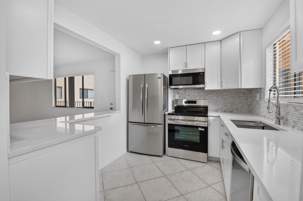 Photo of 15216 LAKES OF DELRAY Boulevard #154, Delray Beach, FL 33484 (MLS # B26093407)