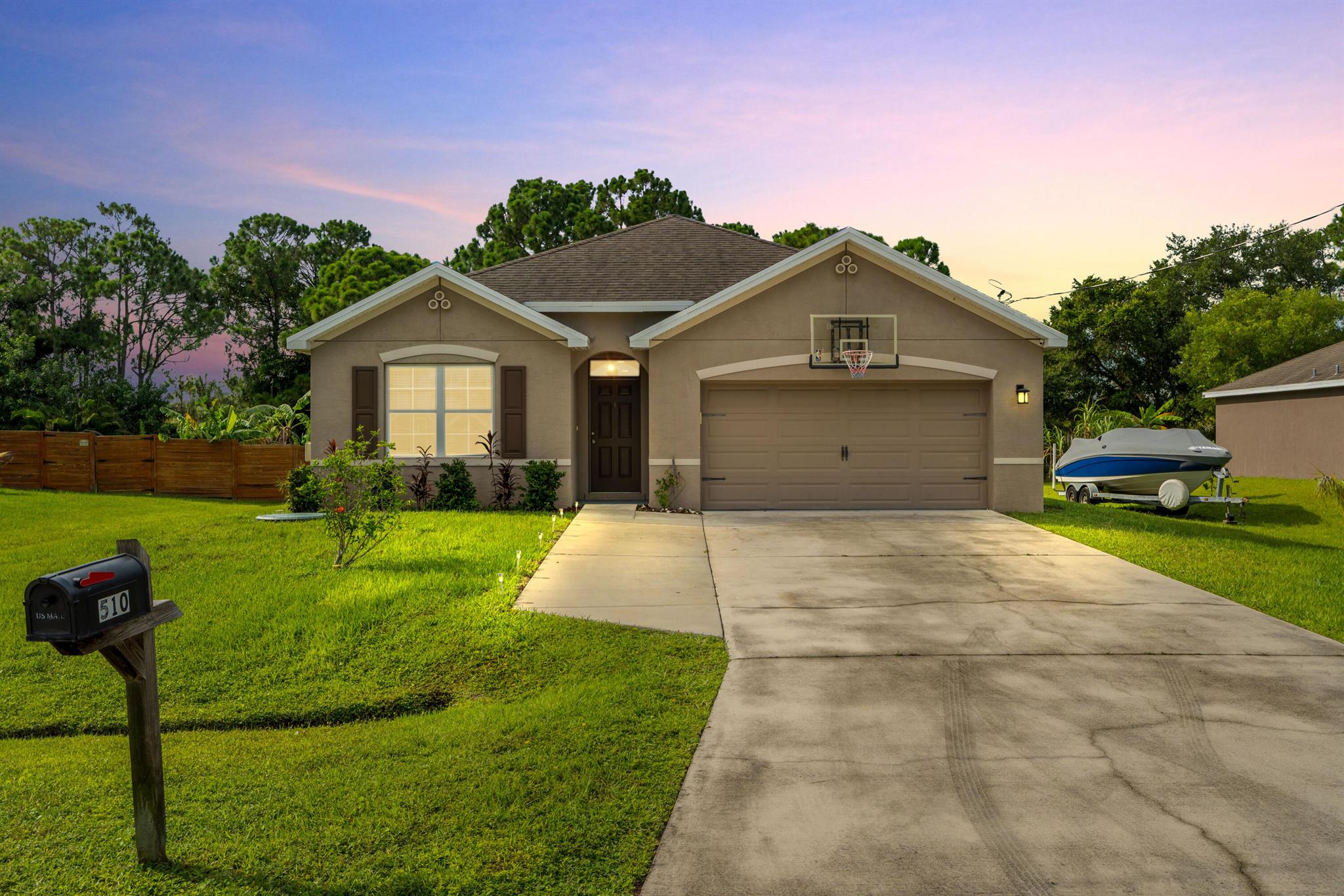 Step into style and comfort in this newer construction 2018 build w/ 4 bedrooms, 2 bathrooms. This home features fresh interior paint, a bright open layout, + a private split-bedroom design. Relax in the 2-year-old hot tub overlooking a peaceful backyard with no rear neighbors--just tranquil views of mature trees. Two 240V outlets offer convenience for EV charging (garage) and spa use (patio). Equipped with a UV light purification system for cleaner air! With a 2-car garage, no HOA, + easy access to I-95, Turnpike, shopping, + beaches, this move-in ready home offers the best of Florida living! buyer to verify all measurements/details. SPECIAL FINANCING INCENTIVE: up to $4,000 closing cost credit through Moises Hall w/ Guaranteed Rate, must qualify. Terms + conditions may apply.