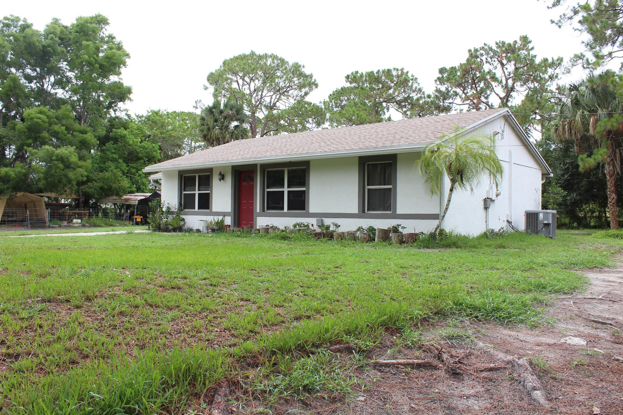 ***AVAILABLE NOW***Nice, private, 3 Bedroom, 2 Bathroom, home on a large 1.15 acre lot with a large storage shed. Split floorplan with a spacious master bedroom with a walk in closet. Interior laundry room with washer and dryer. ROOM FOR RV, BOAT, TRUCKS OR TRAILERS. FENCED YARD. Tile throughout the entire home. New roof and new water filtration system. Pets welcome! Located close to Northlake Blvd, you have quick access to many shops, restaurants, and groceries only 10 minutes away.