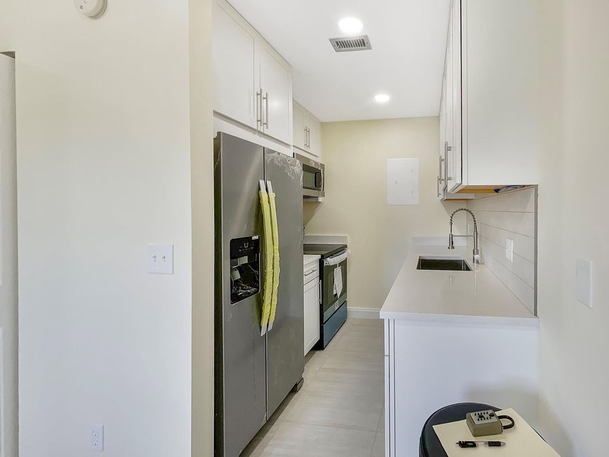 Stunning remodeled 2nd floor condo in Forest Hills with all new appliances, all new floors and more! One of Coral Springs' best-kept secrets! This gem features a newer roof, gorgeous new flooring throughout, fresh paint, modern appliances, and stylish LED ceiling lights. Popcorn ceilings removed for a clean, contemporary look. Recently passed 40-year inspection with flying colors. Enjoy full-size washer/dryer convenience plus amazing community amenities including multiple tennis courts, beautiful pool with serene lake views, and abundant parking. Perfectly nestled in this charming, quiet neighborhood while being close to everything Coral Springs offers. Turn key and Move-in ready!