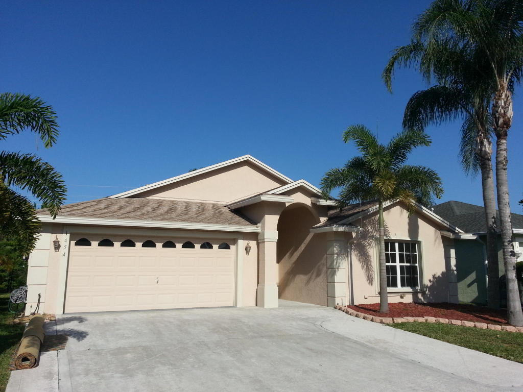 Located in a gated community, this 3-bedroom, 2-bath, waterfront home has an endless list of upgrades. The open living space features vaulted ceilings, tile flooring, updated kitchen with granite counters, stainless steel appliances, breakfast bar, 2 pantries, large dining area and picturesque views of the backyard and canal. Sliding doors in the living room and master suite open to the 300 sq. ft. screened in patio, complete with built in grill and tile floors. Other features include: accordion hurricane shutters, high end fixtures, natural gas for dryer and water heater, alarm system, wide 2-car garage with work bench and extra cabinets, fenced backyard yard and more. Quick move in possible. Small pets accepted with deposit.