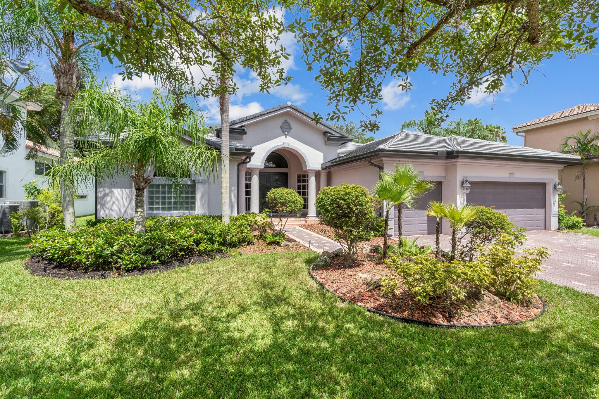 Beautifully updated 4BD/3BA + office + bonus/guest room in The Estates (Chateau Model) subdivision of Heron Bay. New roof (2023). Open & bright with lots of natural light. Huge, fabulous kitchen with massive 8’x6’ island, Quartzite countertops, coffee maker & tons of storage. 5’ porcelain tiled floors. Very private ensuite primary bedroom with large, renovated bathroom, 2 walk-in closets & its own pool access. 3 recessed wall mounted electric fireplaces. Screened-in entertainment area with summer kitchen. Heated saltwater pool. 3-car garage. Multiple clubhouses, one of which you can walk to. Heron Bay has it all including waterpark, heated resort-style community pools, exercise rooms, 24-hour guard gated & much more. Great schools & close to shopping & dining.