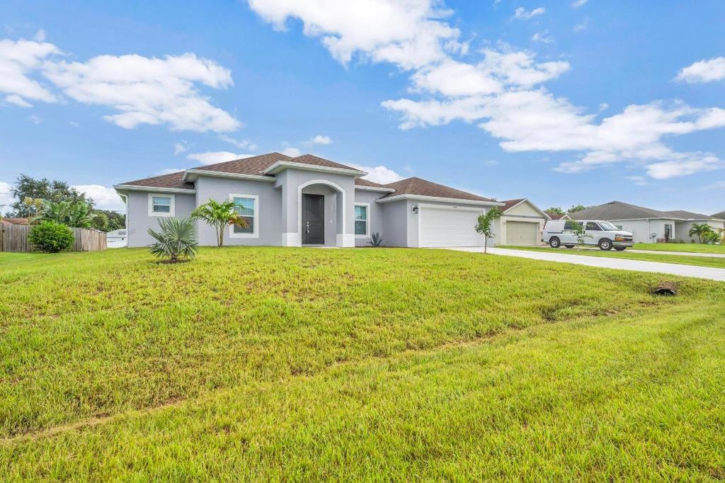 Photo of 1445 SW Leisure Lane, Port Saint Lucie, FL 34953 (MLS # R10943415)