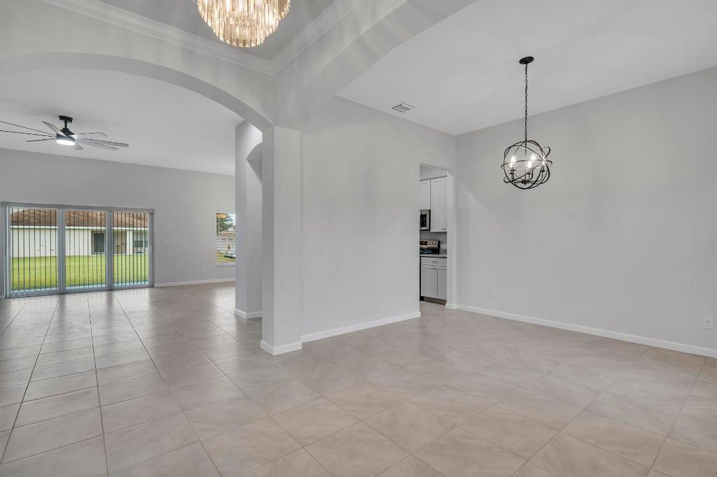 Photo of 1445 SW Leisure Lane, Port Saint Lucie, FL 34953 (MLS # R10943415)