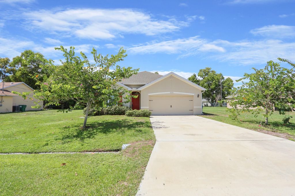 Photo of 2550 SE Rock Springs Drive, Port Saint Lucie, FL 34952 (MLS # R11121642)