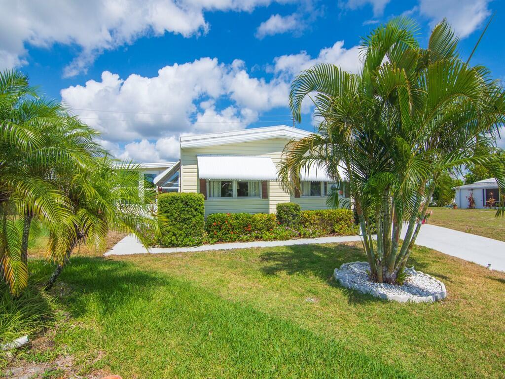 You gotta check this one out! Beautiful open living area with a huge workshop and room for the golfcart. Newer flooring, remodeled bathrooms and roof is only 4 years old. Pinelake Village is an active 55+ community located in Jensen Beach. Lot rent is only $724 per month which includes cable, trash removal, recycling and all the amenities of the clubhouse. Schedule your private tour today and discover the lifestyle you've been dreaming of!