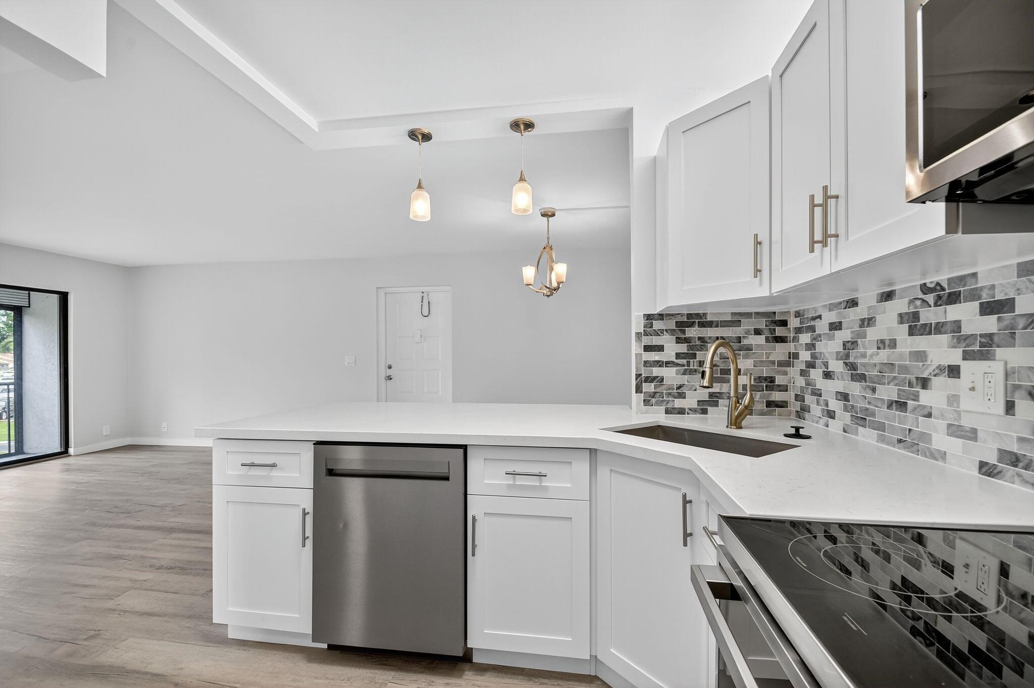 SELLER WILL PAY THE FIRST 6 INSTALLMENTS OF CONDO FEES WITH FULL PRICE OFFER. NO RENTING RESTRICTIONS! Welcome to this 2nd floor Corner unit Condo with lake views. Completely upgraded 2 bedroom 2 bath condo in the great Pine Ridge North 55+ Community. Be the first to enjoy the comfort and peace of mind of all the new items in this fully renovated unit. New HVAC and Hot Water tank. New stainless steel appliances, updated electric, all new light fixtures, both bathrooms redone top to bottom, new luxury vinyl flooring throughout, New balcony screens with hurricane protection, Freshly painted, Walk In Closets, Open concept kitchen/dining room/family room, Low Condo fee includes water, roof, community pool, and Clubhouse. Roof 1 yr old, Can be rented immediately.