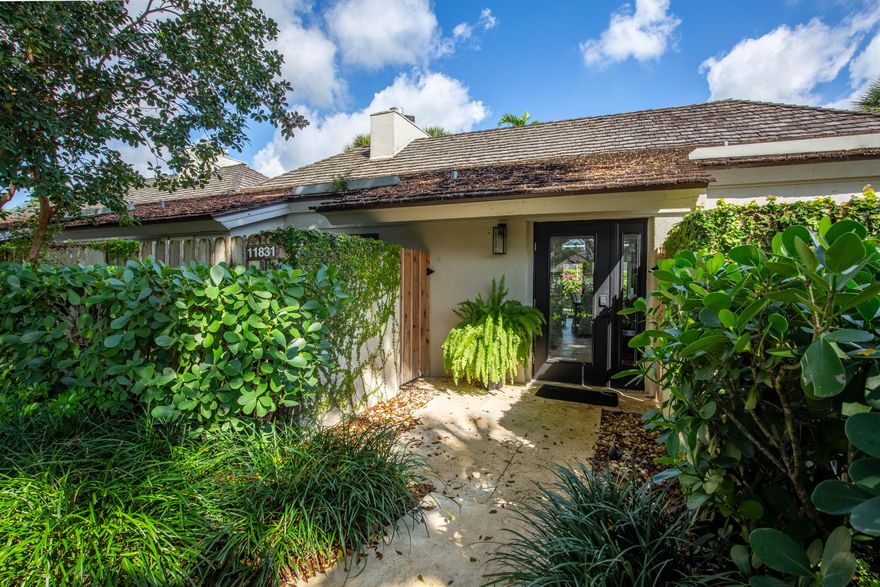 Beautiful bungalow in the highly sought after Palm Beach Polo and Country Club.  This gem has 2 bedrooms, one with a wood burning fireplace, 2 full baths, living room with another wood burning fireplace and a full kitchen.  There is a fully fenced yard across the entire back of the bungalow which is easily accessed from both bedrooms and the living room.  All impact glass, fully furnished and ready to go!!! none