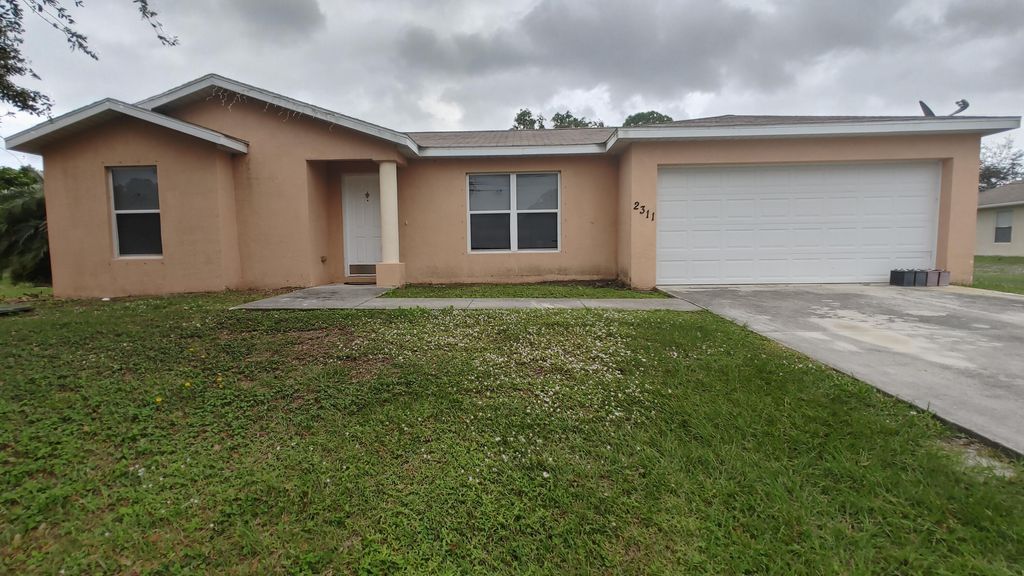 Photo of 2311 SE Charleston Drive, Port Saint Lucie, FL 34952 (MLS # B26002220)