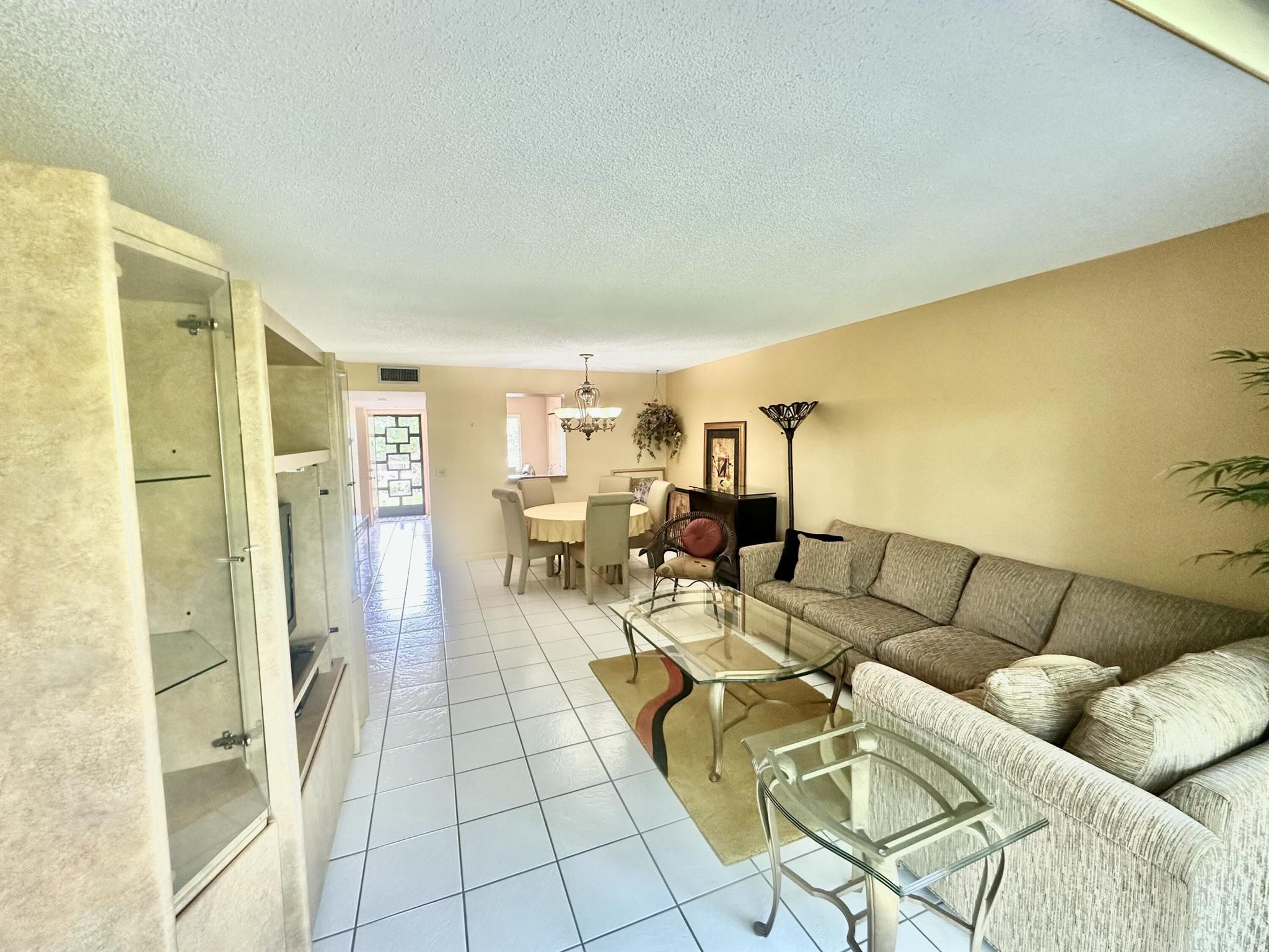 This Lovely third-floor condo in the desirable 55+ community of Huntington Lakes offers the quintessential resort lifestyle. The bright and spacious 2-bed, 2-bath unit features a master bedroom with 2 huge walking closet, an enclosed lanai perfect for enjoying picturesque surroundings As a resident, you'll have access to the recently renovated 50,000-square-foot clubhouse, which includes a state-of-the-art fitness center, a theater for live shows, and both indoor and outdoor swimming pools ,pickleball courts by your building and the clubhouse Experience a vibrant and active social calendar just a short drive from shopping centers .restaurants and Delray Beach's famous Atlantic Avenue..